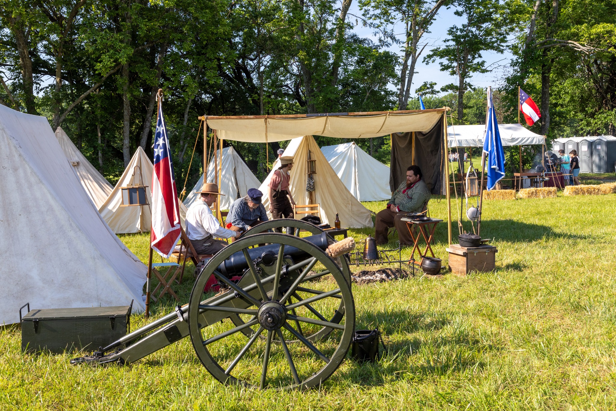 Artillery and camp with battle flags