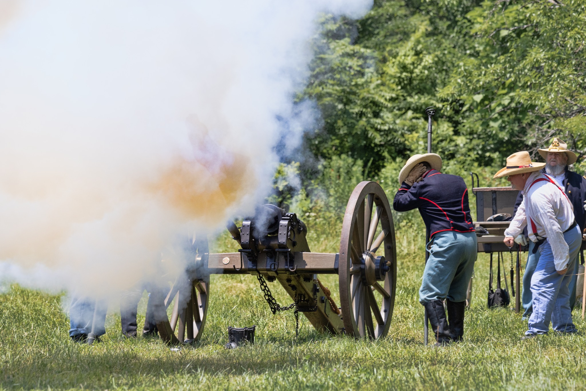 Artillery smoke fills the field